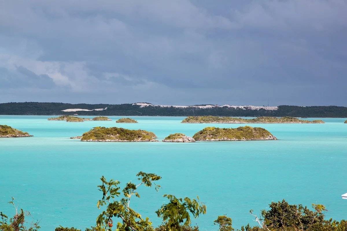 Small rocky cays scattered across the vivid turquoise water of Chalk Sound on Providenciales
