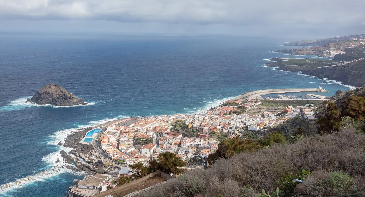The coastal town of Garachico, its natural rock pools and the Roque de Garachico islet on Tenerife's north coast