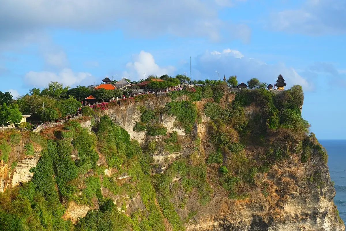 Pura Luhur Uluwatu temple perched on a sheer limestone cliff above the Indian Ocean on Bali's Bukit Peninsula