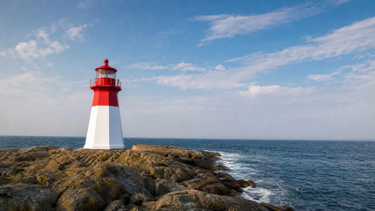 A small white-and-red lighthouse