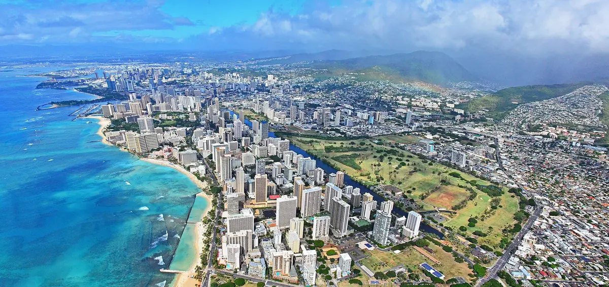 Aerial view of Waikiki Beach, its hotel towers and the Ala Wai district of Honolulu along Oahu's turquoise south shore