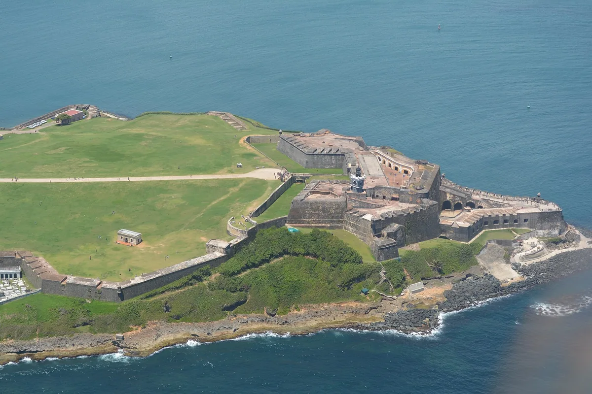 Aerial view of the Castillo San Felipe del Morro fortress and its green lawns on the headland of Old San Juan, Puerto Rico