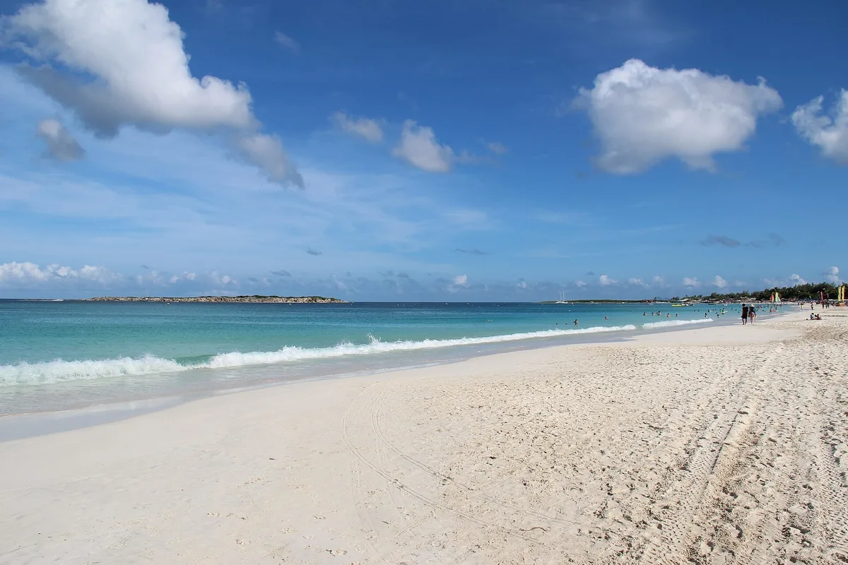 The long white sand beach and turquoise water of Orient Bay on St. Martin
